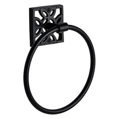 a black towel ring with an intricate design on the front and back ends, hanging from a wall