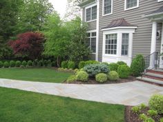 a house with landscaping in the front yard