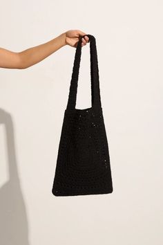 Lovingly handcrafted from 100% cotton using our signature in-house technique, the Piccolo Crochet Bag in Black features a relaxed tote shape, a fixed wide strap and an intricately woven square pattern. Designed to fit all of your sunshine essentials and carry you through summer moments with ease. The Piccolo was handmade in Bali, taking 2 days to carefully complete each piece. Summer Moments, Handmade Crochet Bags, Maxi Dress Sale, Crochet Tote Bag, Tote Bags Handmade, Crochet Tote, Black Features, Faithfull The Brand, Black Crochet