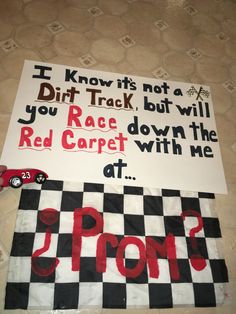 a sign that says dirt track but will you race down the red carpet with me at 1 p m?