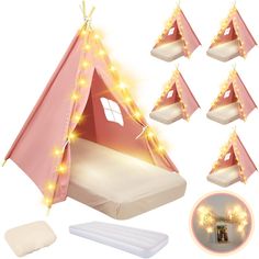 a pink teepee tent with lights on it and four mattresses in front of it