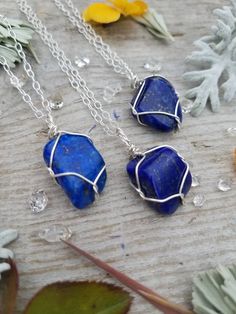 The contrast of colors on these dark blue lapis pieces with the silver just takes my breath away, theyre stunning in silver! Idk why i didnt offer these sooner ♡ each piece is wire wrapped in pure silver wire Price includes a leather or faux leather chord, or we have sterling silver chains available for just $10♡ check our shop for these in copper wire! Please feel free to ask any questions about any of my items! <3 Find us on instagram for promotional sales and giveaways!! @constantruckus Blue Sodalite Pendant Necklace, Blue Lapis Lazuli Crystal Necklace As A Gift, Blue Lapis Lazuli Crystal Necklace For Gift, Blue Lapis Lazuli Crystal Necklace - Perfect Gift, Blue Wire Wrapped Crystal Necklace For Healing, Sapphire Crystal Necklace For Gift, Blue Lapis Lazuli Pendant Necklace, Blue Lapis Lazuli Gemstone Necklace, Handmade Blue Lapis Lazuli Crystal Necklace