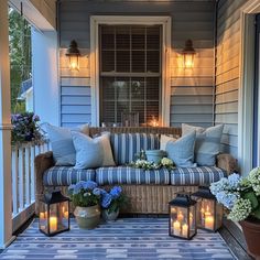 a couch sitting on top of a blue and white porch