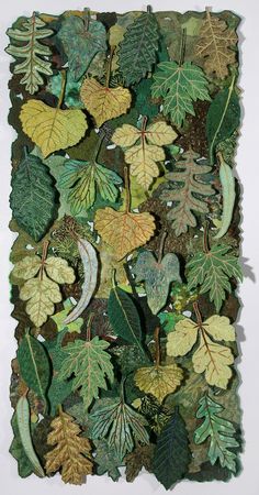 an art work made out of leaves and other things