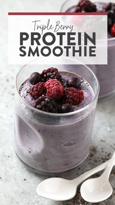 triple berry protein smoothie in a glass with spoons