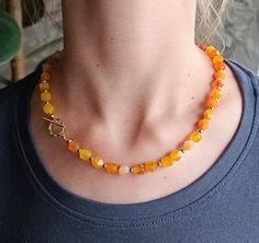 A simple elegant orange-peach carnelian necklace, a summer necklace with gilded details. The necklace would make a good gift for your mother, wife, girlfriend, sister or daughter. Necklace in yellow-orange-gold tones is an August stone for her. materials: orange-yellow carnelian, details - gold plating 14K, 24K. Necklace length 16 - 16.5 inches (40 cm  - 42 cm). If you need an extension chain, please notify me when purchasing (message to seller) and I will make a 1.5 inch (4 cm) extension chain Formal Orange Carnelian Necklace, Orange Carnelian Gemstone Necklace, Adjustable Carnelian Orange Jewelry, August Stone, Orange Faceted Carnelian Necklace, Hand-strung Orange Carnelian Necklaces, Peach Necklace, Carnelian Necklace, Jaune Orange