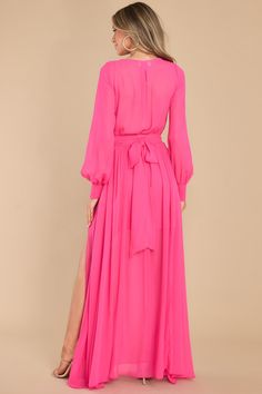 I'm pretty Hard To Impress. but you have caught my attention in this lovely hot pink maxi dress! What an elegant silhouette you have with this self-tie belt and sheer sleeves! I'm sure your sweetheart will be as impressed as I am! This maxi dress features a V-neckline. an elastic waistband with a self-tie belt. side belt loops. and sheer buttoned sleeves. Model is wearing a small. • 100% Polyester • Hand Wash Cold • Lined • Imported Hot Pink Maxi Dress, Sorority Rush Dresses, Side Belt, Rush Dresses, Cardigan Crop Top, Hot Pink Dresses, Red Dress Boutique, Pink Maxi, Long Crop Top