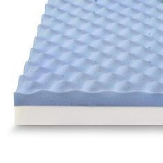 a close up view of a foam mattress on a white background