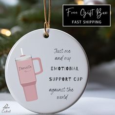 a ceramic ornament with a pink coffee cup on it and the words, free gifts for you fast shipping