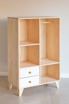 a wooden bookcase with two drawers on one side