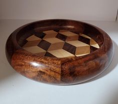 a wooden bowl sitting on top of a table