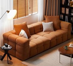 a living room filled with furniture and bookshelves