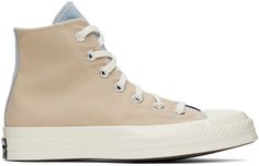 High-top canvas sneakers colorblocked in beige, blue and navy. · Round rubber cap toe · Lace-up closure · Eyelet vents and logo patch at inner side · Canvas lining · Cushioned Ortholite® insole · Rubberized logo patch at heel · Treaded rubber sole Supplier color: Navy/Oat milk/Ocean Navy Chuck 70, Converse Beige, Navy Converse, Sport Shoes Men, Chuck 70, Oat Milk, Outdoor Men, Sneaker Collection, Canvas Sneakers