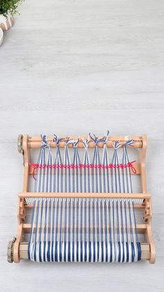 an old weaving machine with blue and white stripes