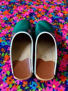 "This listing is for an incredibly groovy and unique pair of vintage 70s Bastad-Joffeln Made in Sweden shiny green clogs! Such a spunky pair of clogs - a real showstopper! These totally great vintage clogs are in excellent vintage condition, showing some age-appropriate signs of general wear and tear. There are a few scuffs, here and there and some wear to the rubber souls, but overall, considering their age they are in great shape and still have a lot of life to live! These are marked as a size Vintage Closed Toe Mules With Rubber Sole, Green Clogs With Rubber Sole And Round Toe, Vintage Slip-on Clogs With Rubber Sole, Green Clogs With Wooden Heel And Round Toe, Green Clogs With Rubber Sole And Closed Toe, Green Closed Toe Clogs With Wooden Heel, Green Pillar Candles, Vintage Clogs, Rubber Soul