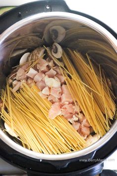 pasta with meat and mushrooms in an instant pot on the stove top, ready to be cooked