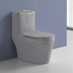 a white toilet sitting next to a blue wall in a bathroom with yellow trimmings