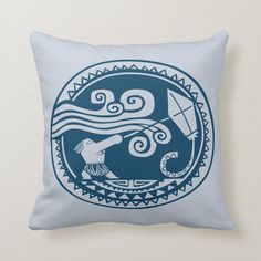 a blue and white pillow with an image of a man holding a kite in the ocean