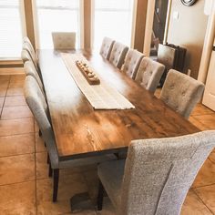 a dining room table is set with chairs