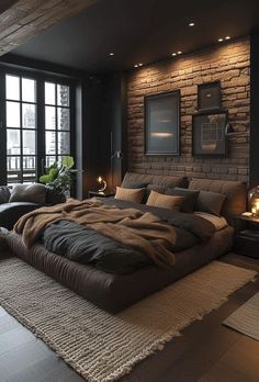 a large bed sitting in the middle of a living room next to a brick wall