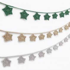 crochet star garland with green and white stars hanging from it's sides