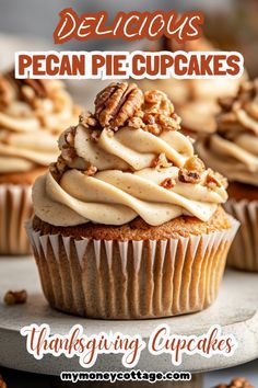 delicious pecan pie cupcakes with icing and walnuts on the top