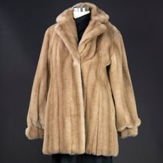 Vintage Emilio Pucci faux fur coat. This is an extremely rare coat that is in perfect condition.  Size: vintage 10 Length: 30 inches Bust: 41 inches Color: Palomino Fabric: Faux fur Care: Dry clean Condition: Mint Classic Mink Faux Fur Coat, Classic Mink-colored Faux Fur Coat, Classic Mink Color Faux Fur Coat, Vintage Pucci, Pucci Vintage, Hostess Dresses, Liz Taylor, Jackie O, The 1960s