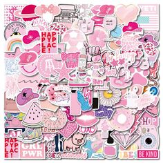 a large pile of pink stickers on top of a white surface with hearts and other items