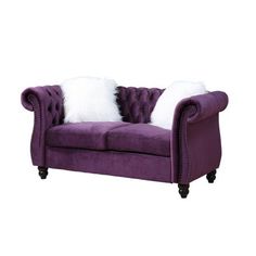 a purple couch with two white pillows on it