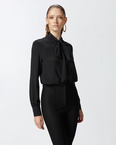 Feminine shirt in lightweight silk-blend crepe de Chine fabric with round neck and neck sash that ties into a bow to give the look an original finishing touch. Long sleeves with cuff and placket with mother of pearl-effect buttons down the front. The main fabric is made with 69% viscose from responsibly managed forests. Limo Black, Feminine Shirts, Suit Jumpsuit, Calf Length Skirts, Casual Blazer, Mid Dresses, Mid Length Dresses, Dress Suits, Casual Jacket