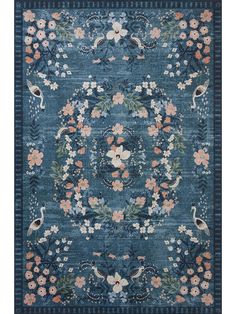 a blue rug with flowers and birds on it