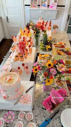 a table filled with lots of food and desserts