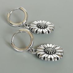 A PAIR of sterling silver hoops. Comes with a cute detachable sunflower charm. The charm is multipurpose and can be used with a neck or bracelet chain too. Dimension: Hoop- 12 mm Charm: 14 x 14 mm Drop length: 29 mm Weight: 6.80 gm Price listed is for a PAIR of hoops. These earrings are made of 925 hypoallergenic sterling silver Can be packaged in a gift box. I can include a personal message from you if needed You are welcome to contact me at... bhavnakwintra1956@gmail.com For more beautiful pie Adjustable Flower Hoop Earrings For Everyday, Round Hoop Earrings With Flower Charm As Gift, Sterling Silver Earrings With Flower Charm For Everyday, Silver Earrings With Flower Charm For Everyday, Everyday Silver Earrings With Flower Charm, Silver Dainty Flower Earrings For Everyday, Silver Dangle Flower Earrings For Everyday, Dainty Silver Flower Earrings For Everyday, Small Hoop Earrings With Flower Charm As Gift