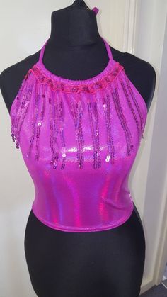 Gorgeous holographic fushia pink lycra crop top with a dangling sequin trim. Perfect for nights out, festivals and holidays. I make to order so other sizes available. Flexible sizing due to tie up straps can get away with one size smaller/larger just tie the straps tighter or looser. Pink Party Crop Top, Pink Sequin Tops For Club, Glamorous Pink Party Crop Top, Glamorous Pink Crop Top For Party, Pink Fitted Crop Top With Sequins, Fitted Pink Crop Top With Sequins, Pink Tops For Club And Party Season, Glamorous Pink Crop Top For Night Out, Party Sequin Stretch Crop Top