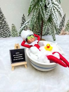 an elf is taking a bath in the snow