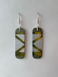 This pair of Mary Bea Art hand painted earrings is completely unique. They are hand crafted by the artist from painted birchwood, sterling silver, and 14k gold. They are durable, comfortable, non-allergenic, and lightweight. Enjoy this piece of wearable art for years to come. Green Hand Painted Sterling Silver Earrings, Artsy Hand Painted Silver Earrings, Hand Painted Earrings Wood, Watercolor Jewelry, Hand Painted Earrings, Adobe Illustrator Tutorials, Painted Earrings, Painted Jewelry, Hand Painted Jewelry