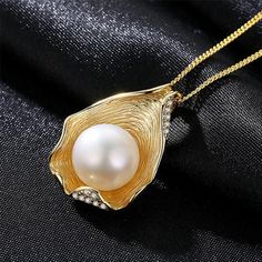 Pendant Necklaces For Women | Dainty Pearl Necklace With Gold Pendant Finish off any outfit with a gorgeous handmade Freshwater pearl necklace from Huge Tomato. With a wide online collection of striking vintage-inspired necklace designs, lovingly made with freshwater pearls and precious stones, treat yourself or a loved one to a piece of vintage jewelry today. Ideal as a gift or to enhance any outfit, our online range includes chunky, and classic white pearl necklaces for a bold vintage look, to Leather Choker Collars, Dainty Pearl Necklace, Pearl Necklace Vintage, Pearl And Diamond Necklace, White Pearl Necklace, Silver 925 Necklace, Pearl Pendant Necklace, Freshwater Pearl Necklaces, Necklace Vintage