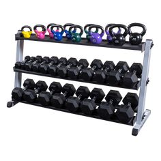 a rack with dumbs and weight plates on it