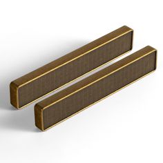 two brown rectangular objects on a white surface