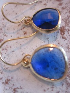 READY TO SHIP! Cobalt Blue Earrings Gold - Bridesmaid Earrings - Wedding Earrings - Valentines Day Gift The blue glass gem is 13mm with 5mm thick at its' widest part. The gem is gold plated. The earwires are gold filled. The length of the earrings is approx 1 inch long. You are sure to stand out in these beautiful earrings! All of my items include a gift box for easy gift-giving for your friends or for yourself! I love custom orders! If you are a looking for a bridesmaid gift, these are perfect. Nickel-free Blue Earrings For Wedding, Gold Bridesmaid Earrings, Bridesmaid Earrings Gold, Cobalt Blue Earrings, Gold Bridesmaids, Lafayette La, Glass Gems, Earrings Wedding, Bridesmaid Earrings