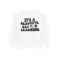 Celebrate the joy of learning with our "It's a Beautiful Day for Learning" shirts and sweatshirts. These garments are a perfect expression of teacher appreciation, ideal for wearing in the classroom or as a heartfelt "thank you teacher" gift during the back-to-school season. With designs that transcend school departments, our collection encapsulates the enthusiasm and dedication of educators who make each day a beautiful opportunity for growth and discovery. Elevate your support for teachers and Relaxed Fit Long Sleeve T-shirt For School, Relaxed Fit T-shirt For School In Fall, Oversized Cotton Sweatshirt For School, Casual Long Sleeve Tops For Back To School, White Tops For Everyday Back To School, Back To School Long Sleeve Cotton Top, White Tops For Everyday Back-to-school Wear, Relaxed Fit Slogan Tops For School, Long Sleeve Sweatshirt With Text Print For School