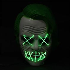 Light up green EL wire Joker mask AA Batteries not included. Batteries can be replaced All EL Wire masks feature a battery pack cord coming from one location on the mask Elastic strap holds mask to the face. Note: All EL Wire makes a high pitched noise. Material: PVC and EL cold light Power supply: 2 x AA battery ( not included ) Perfect for costume parties, Halloween, cosplay, theme parties and more! Ages 12+. Green Halloween Masquerade Mask And Prosthetics, Green Halloween Masquerade Mask, Green Halloween Cosplay Mask, Joker Mask, Scary Halloween Masks, El Wire, Halloween Festival, Carnival Costumes, Halloween Masks