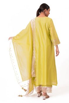 Lime green kurta with embroidered banarasi jacquard tissue yoke. Paired with a slub silk pant and chanderi dupatta with scalloped tissue detailing. - Aza Fashions Pista Green Dupatta For Spring With Traditional Drape, Spring Pista Green Dupatta With Traditional Drape, Spring Pista Green Traditional Drape Dupatta, Green Cotton Silk Dupatta For Spring, Spring Green Cotton Silk Dupatta, Spring Green Sharara With Sheer Dupatta, Green Palazzo Set With Sheer Dupatta For Summer, Elegant Green Palazzo Set With Self Design, Spring Green Anarkali Set With Sheer Dupatta