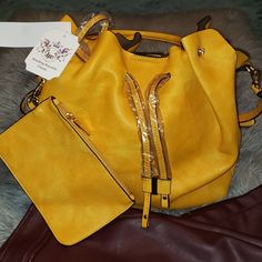 Mustard Handbag/Shoulder Bag With Detachable Makeup Pouch. Draw String. Inside Zip Pocket.Pictures Show The Gold Details. Brand New Vegan Bag. Yellow Bucket Bag With Detachable Handle, Yellow Satchel With Detachable Handle In Pouch Shape, Yellow Bucket Shoulder Bag With Detachable Strap, Trendy Yellow Hobo Bag With Removable Pouch, Yellow Satchel With Detachable Handle, Yellow Pouch Bucket Bag With Detachable Strap, Yellow Bucket Bag With Detachable Strap, Yellow Bucket Shoulder Bag With Detachable Handle, Yellow Pouch Shoulder Bag With Detachable Handle