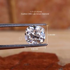 an image of a diamond cut in half on a piece of metal with measurements for it