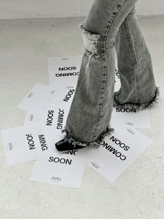 a person standing on top of some white papers