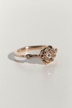 The Rosette ring features a sculptural rose that holds an antique, old-mine cut diamond in the center of it's petals, and is accented by two diamonds on the sides. Approx .14ct total for the three diamonds. The rose is approx 9mm in diameter. I designed this ring to be easily customizable. Whether that be by using the birthstones of your choice, or heirloom diamonds you inherited from a loved one, please send us an email here if you'd like to personalize this design. Made to order, please leave Scrap Material, Design Master, Sustainable Fashion Brands, Social Impact, Recycled Gold, The Rose, White Roses, Sustainable Fashion, Diamond Cuts