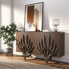 a living room scene with focus on the sideboard and plant in front of it