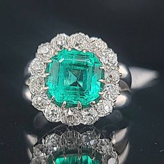 GORGEOUS platinum Vintage engagement ring natural colombia emerald ring circ 1930's  center Natural green emerald in emerald shape weight 3.02ct. size 8.6x8.5mm AGL CERT  nice rich green color , clean, very lively ,very brilliant ,amazing  cut .  side  natural old mine cut diamonds weight  1.75ct  SI1-H ring size 5 Resizable  1old ring in a very good condition.  Retail value $29,500 net.  Appraisal available Gia Certified Green Diamond Ring In Vintage Style, Vintage Green Emerald Ring Gia Certified, Vintage Green Diamond Ring In Platinum, Antique Emerald Ring With Prong Setting, Vintage Green Diamond Platinum Ring, Vintage Green Emerald Ring With Brilliant Cut, Gia Certified Green Platinum Cluster Ring, Vintage Emerald Ring With Vvs Clarity, Vintage Emerald Ring With Vvs Diamond