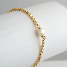 "Delicate Pearl Bracelet,Rose Gold Pearl Bracelet,Wedding Jewelry,Flower Girl Gift, 14k Gold Fill,Sterling Silver,Rose Gold,Gift for Her, A delicate pearl is wire wrapped on your choice of 14K Gold Fill, Rose Gold or Sterling Silver Chain. This gorgeous natural pearl Bracelet is great for layering with our bar bracelets. A beautiful and simple Perfect Gift for Her, birthday gift, bridesmaid, flower girl or christmas gift. *listing is for one pearl Bracelet | BRACELET DETAILS | - strong, quality Classic Gold Single Strand Bracelet As Gift, Classic Single Strand Gold Bracelet As Gift, Classic Single Strand Gold Bracelet For Gift, Classic Gold Bracelet Single Strand Gift, Classic Single Strand Gold Bracelet Gift, Gift Single Strand Round Gold Bracelet, Gold Single Strand Bracelet For Gift, Delicate Single Strand Bracelets As Gift, Delicate Single Strand Bracelets For Gifts